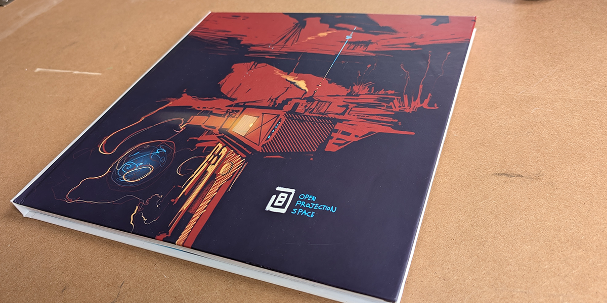 Open Projection Space book, cover on a surface